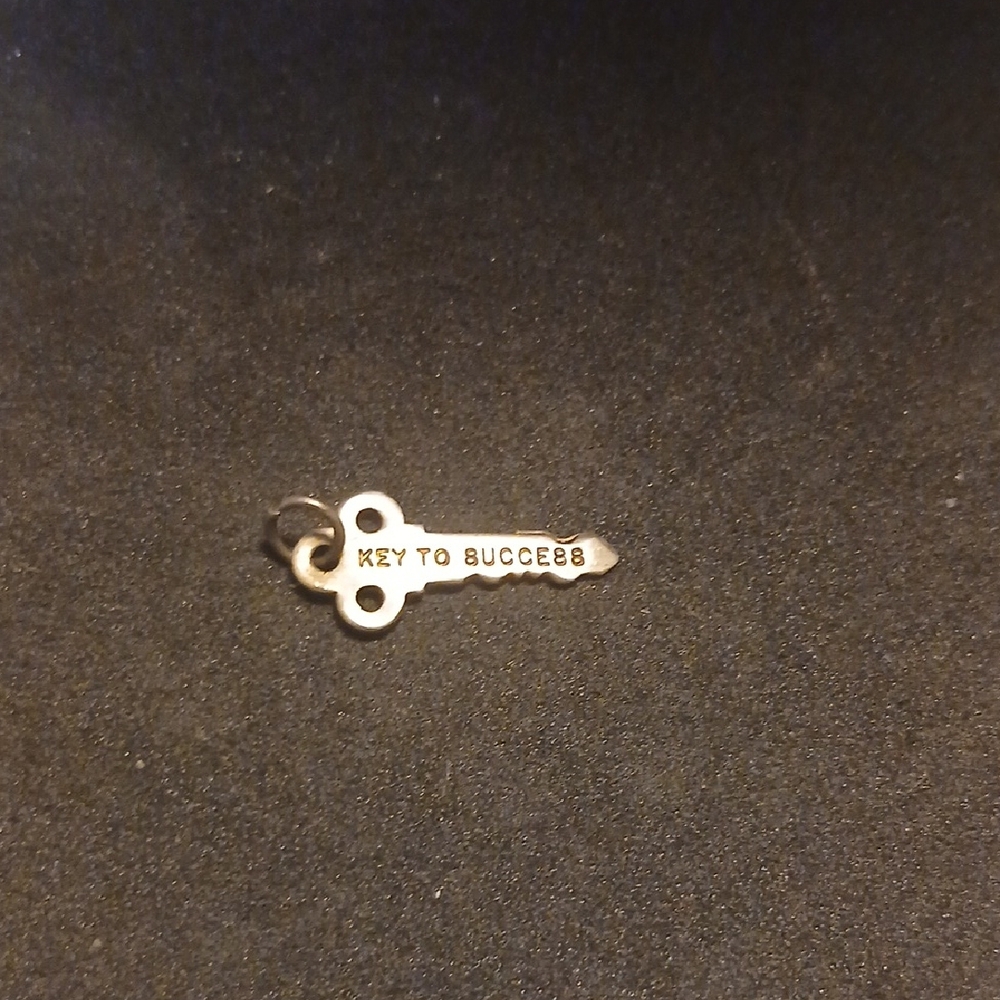 Cute Sterling Silver Charm- " Key To Success."